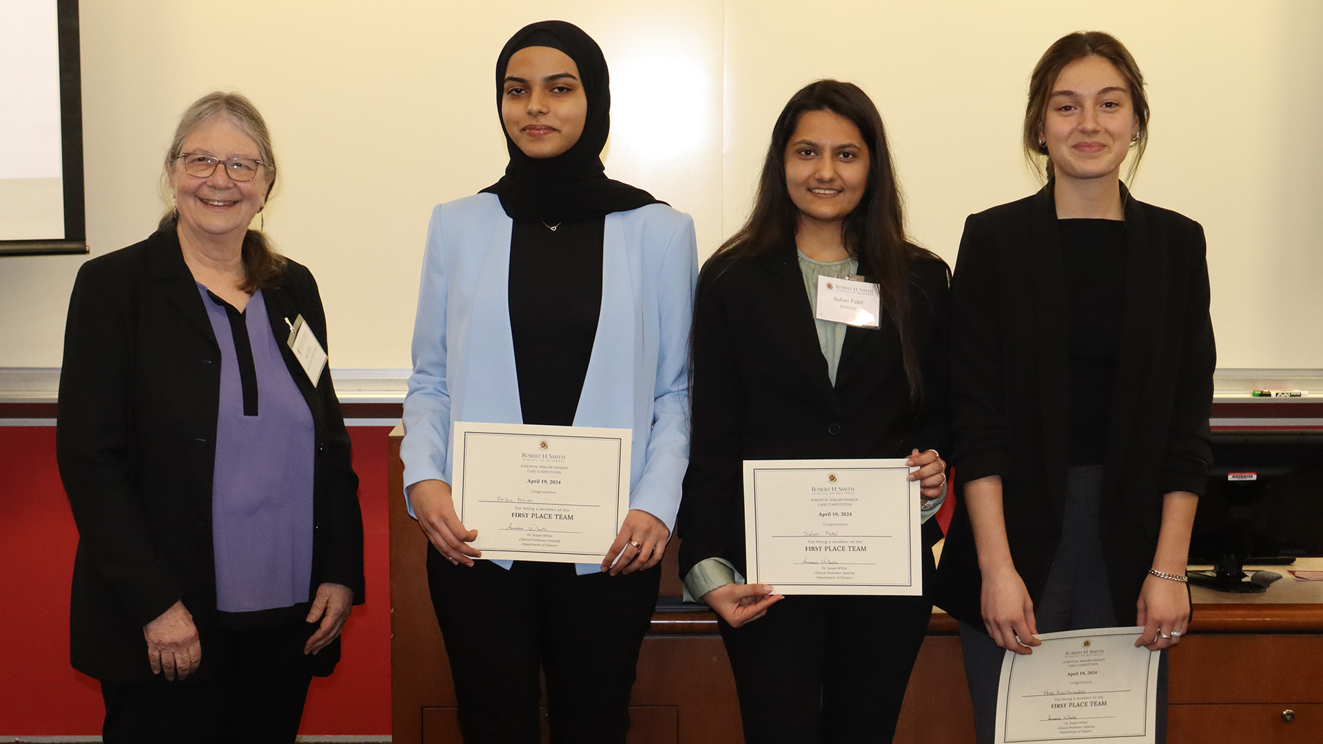 Areeba Asim, Ana Kavtaradze, and Saloni Patel take the top spot with their outstanding performance and innovative solutions, pictured here with Clinical Professor Emerita Susan White.