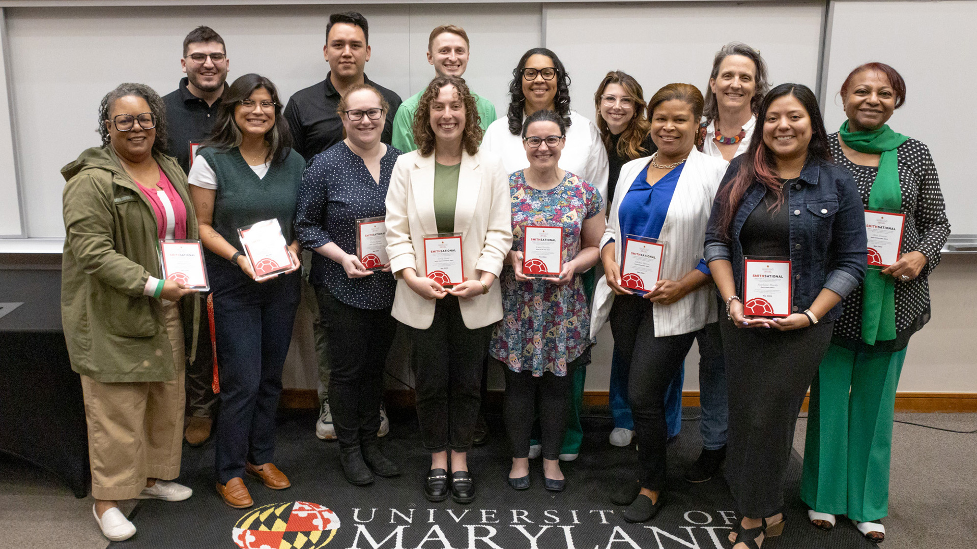 Celebrating Dedication: A group of Smith School staff award winners proudly showcase their well-deserved honors. Your hard work and commitment make our community thrive.
