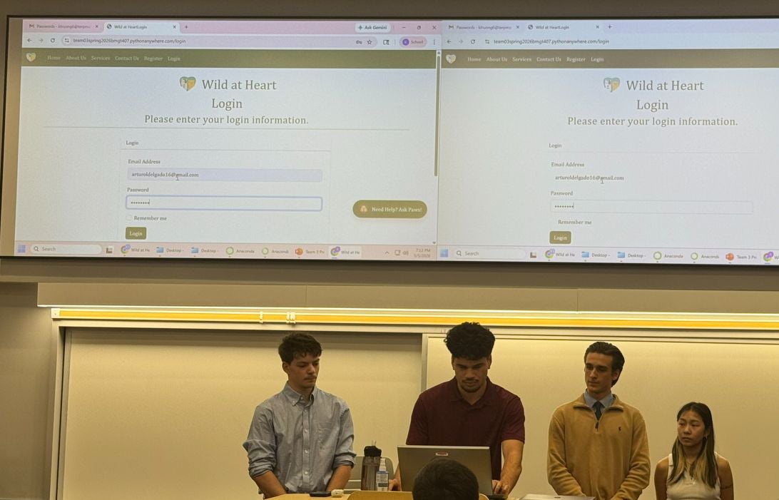 Student team presenting the Wild at Heart website login page during a classroom project presentation.