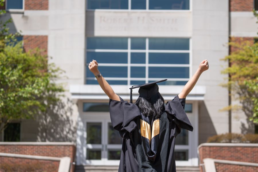 graduate in cap and gown