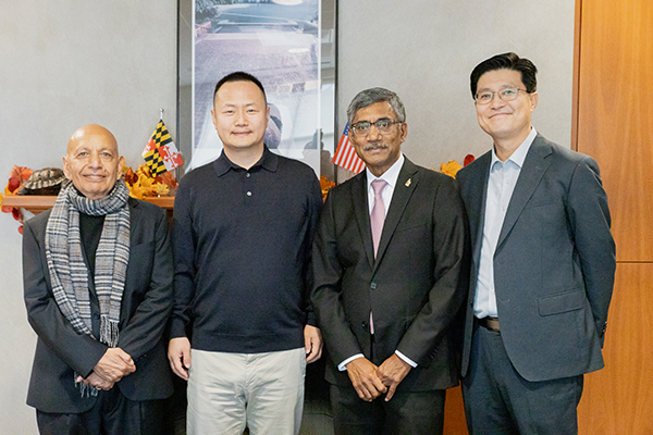 Alumnus and Donor Long Jiang with Dean Prabudev Konana and professors