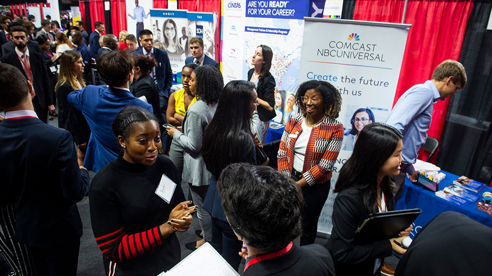 students and potential employers gathered in conversation