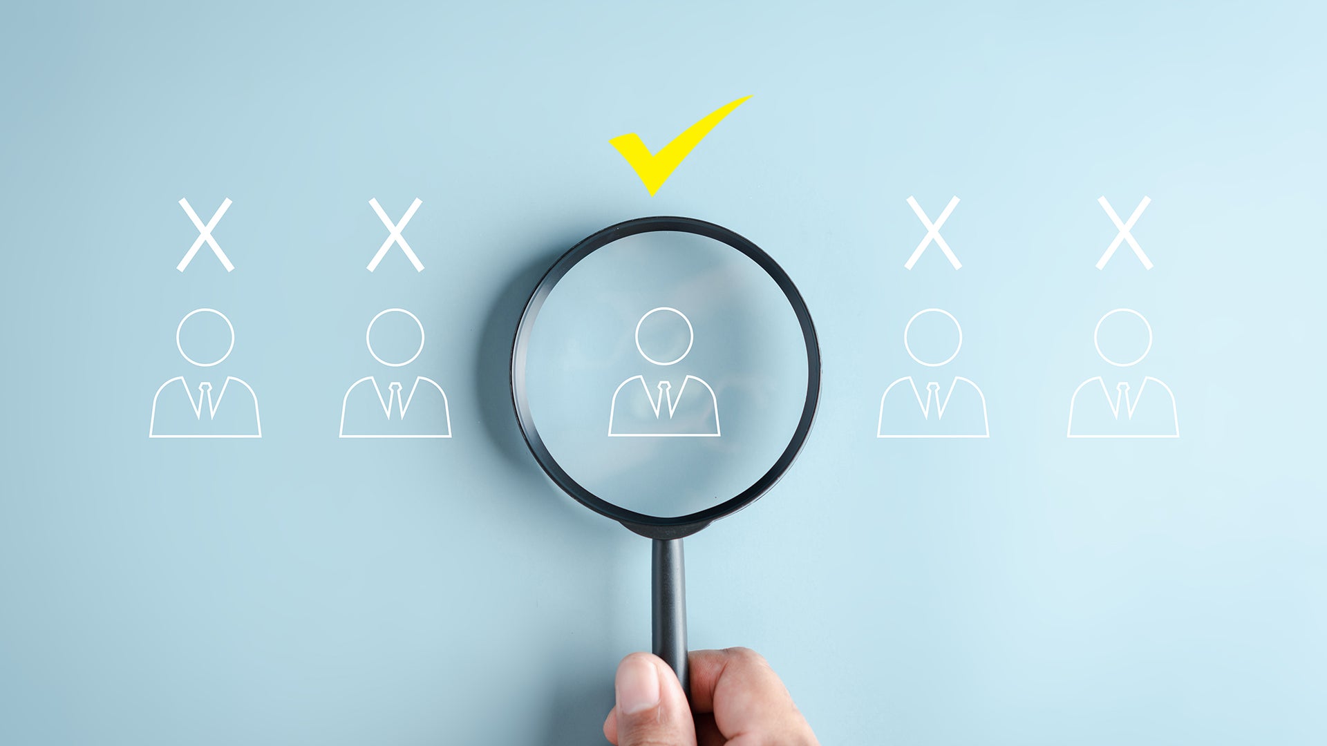 Magnifying glass highlighting one job candidate among others, with a check mark above.